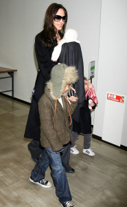 Angelina Jolie carrying baby Vivienne Marcheline and holding Zahara and Pax hand at Narita International Airport on January 27th in Narita  Chiba  Japan