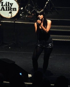 Lily Allen singing live on stage