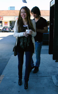 Miley Cyrus and Justin Gaston buying frozen yogurt on Jan 28th, 2009