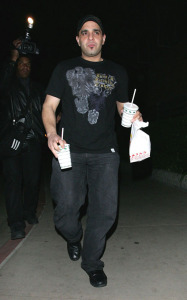 Sam Lutfi old candids with a take-out meal box