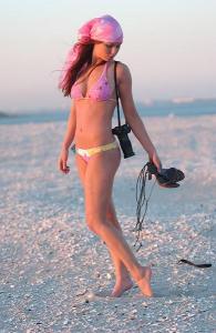 Brittany Flickinger on the beach wearing a pink head-band