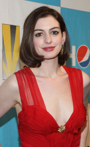 Anne Hathaway in a red v-neck dress