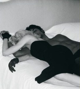 Madonna and Jesus Luz sleeping on bed at a hotel room