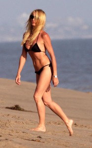 Nicollette Sheridan wearing a black bikini on the beach in Malibu