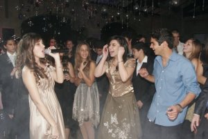 lara scandar sings at a party