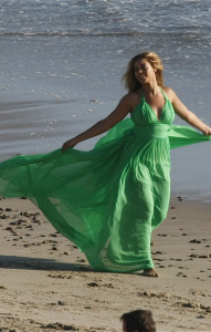 Beyonce Knowels latest video shoot on the beach in Malibu wearing a glam green dress