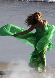 Beyonce Knowels latest video shoot on the beach in Malibu wearing a glam green dress