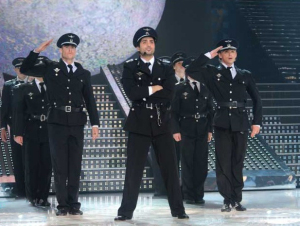 Bash from Syria singing onstage with a police outfit on the 10th prime of staracademy season 6