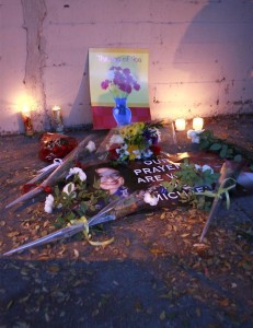 fans lighting candles and placing flowers outside the gates of Michael Jackson Holmby Hills home