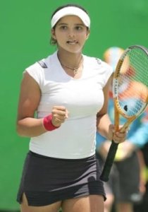 Sania Mirza during a tennis game wearing a white top and a black skirt