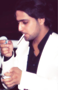 Abdul Aziz Abdel Rahman photo while smoking a cigarette