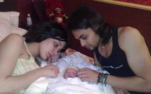 Raqiah and her husband Mohamad with their baby new born son