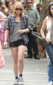 Emilie de Ravin on the filming set of her upcoming movie Remember Me wearing a black denim shorts with a gray top