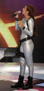 LBC entertainmet show Twist and Shout 1st episode picture of the hostess Amal Boshoshah at the beginning of the program wearing a latix gray outfit