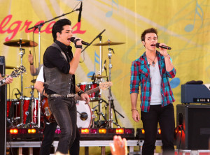 Kris Allen with Adam Lambert performing on stage during Good Morning America at Rumsey Playfield Central Park on August 7th, 2009 in New York City