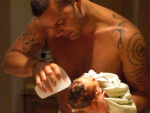 picture of ricky martin during the first baby bath of one of his two baby born twins