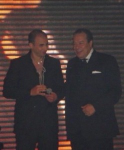 Mohamad Qwaider picture at a public awards event with is award