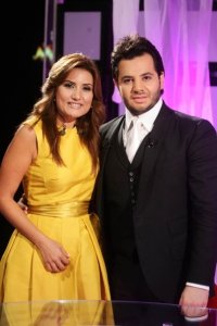 Nishan Deirharoutinian picture with lebanese reporter shatha omar at the TV talk show Il Maestro 1