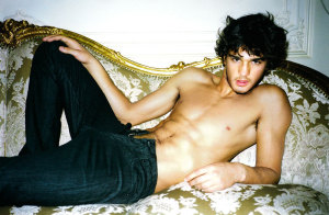 Marlon Teixeira photo shoot for Sergio K menswear campaign of fall and winter of 2009 resting on the arm chair