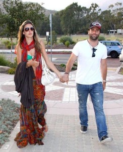 Alessandra Ambrosio walking along with her fiance