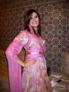 Hanaa Idrisi picture wearing some tranditional outfits as an advertisement 4