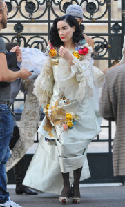 Dita Von Teese poses for a photo shoot for Harpers Bazaar on October 10th 2009 in a white and golden floral dress 5