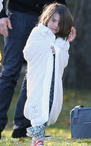 Suri Cruise with her parents at a park in Cambridge Massachusetts on October 10th 2009