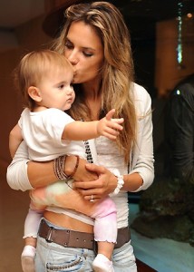 Alessandra Ambrosio spotted with her baby daughter Anja beside a fish tank in the lobby of their hotel in Miami on October 12th 2009 2