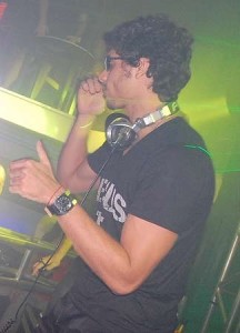 DJ Jesus Luz picture wearing a black tshirt with Jesus Te Ama imprinted on it while playing his music on stage on October 17th 2009 1