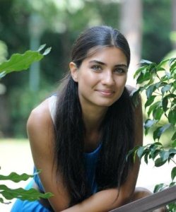 Tuba Buyukustun outdoor photo shoot wearing a blue dress 10