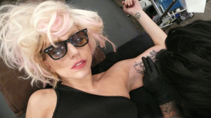 Lady Gaga photo shoot for the October 2009 issue of Interview Magazine while getting a new tattoo