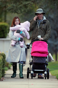 Alyson Hannigan and husband Alexis Denisof spotted together on January 19th 2010 walking with their baby daughter under the rain 3