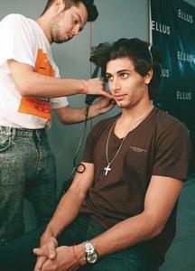 Jesus Luz doing hair and makeup backstage on January 19th 2010 at the Ellus runway show during the Sao Paulo Fashion Week in Brazil 7