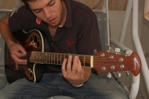 Jack Haddad picture while playing the guitar 4