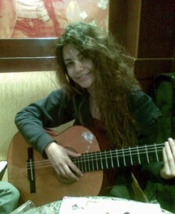 Rania Nageeb playing her guitar