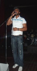 Mohamed Ali singing on stage