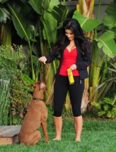 Kim Kardashian seen walking her dog Rocky on February 23rd 2010 wearing a red top under a black sport wear 1