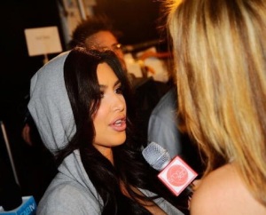 Kim Kardashian spotted at the Bebe Fall fashion show on February 16th 2010 wearing a gray short dress 11