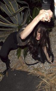 Lindsay Lohan pictures while falling on the ground when at a friends house on March 23rd 2010 in Hollywood 2