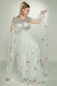 photo shoot of the lebanese singer and model Rola Saed in a white floral dress