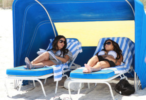 Kim Kardashian and Kourtney Kardashian spotted on March 30th 2010 as they film some scenes for their show Keeping Up with the Kardashians in bikinis on the beach 3