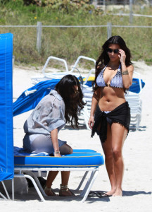 Kim Kardashian and Kourtney Kardashian spotted on March 30th 2010 as they film some scenes for their show Keeping Up with the Kardashians in bikinis on the beach 1