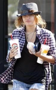 Miley Cyrus was spotted on April 10th 2010 while getting out of Robeks Juice place in Los Angeles 3