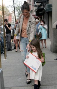 Suri Cruise walks with mom Katie Holmes while carrying a large US Postage envelope on April 8th 2010 in New York City 2