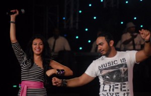 Tamer Hosny with Merhan Hussein on stage during a summer concert 9