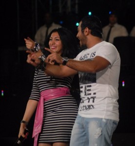 Tamer Hosny with Merhan Hussein on stage during a summer concert 8