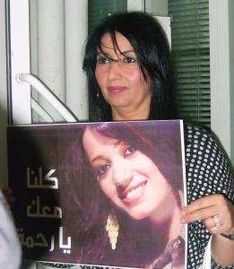 Star Academy Student mother Mrs Fadila holding a poster of her daughter Rahma from Iraq