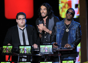 Russell Brand with Jonah Hill and Sean P Diddy Combs speak on stage at the 2010 MTV Movie Awards held at the Gibson Amphitheatre on June 6th 2010 at Universal Studios in California 4