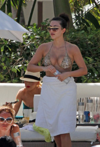 Kim Kardashian seen wearing a tiger patterned bikini swim suit on June 12th 2010 by the pool side at the Fontainebleau Hotel resort 9