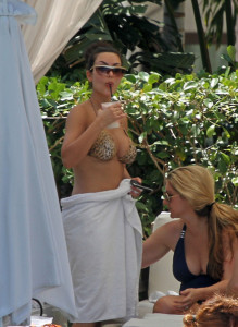 Kim Kardashian seen wearing a tiger patterned bikini swim suit on June 12th 2010 by the pool side at the Fontainebleau Hotel resort 10